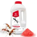 Biała butelka VACO MAX Stop Mrówkom granulat na mrówki 1 kg z czerwoną nakrętką, pojedyncze ujęcie produktowe obok kopca czerwonego granulatu i mrówek
